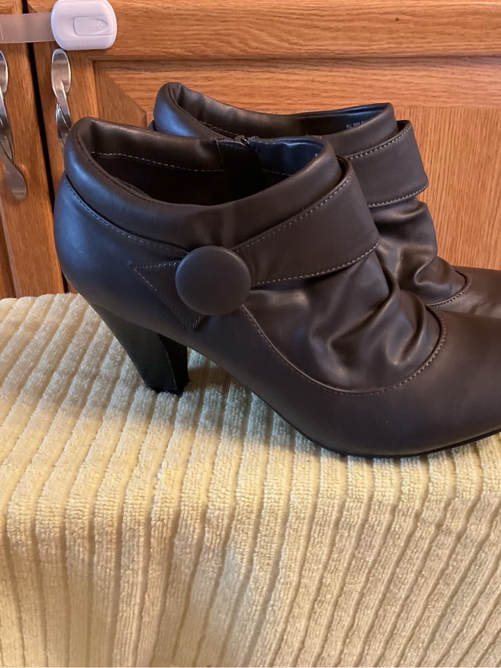 Covington Black Faux-Leather High Heel Ankle Boots with Button Strap